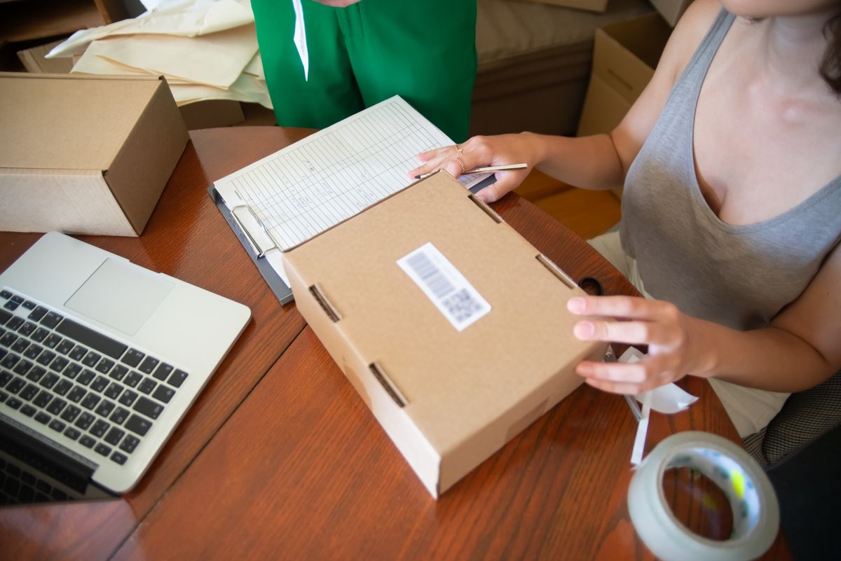 Small business team packing an order at their work table