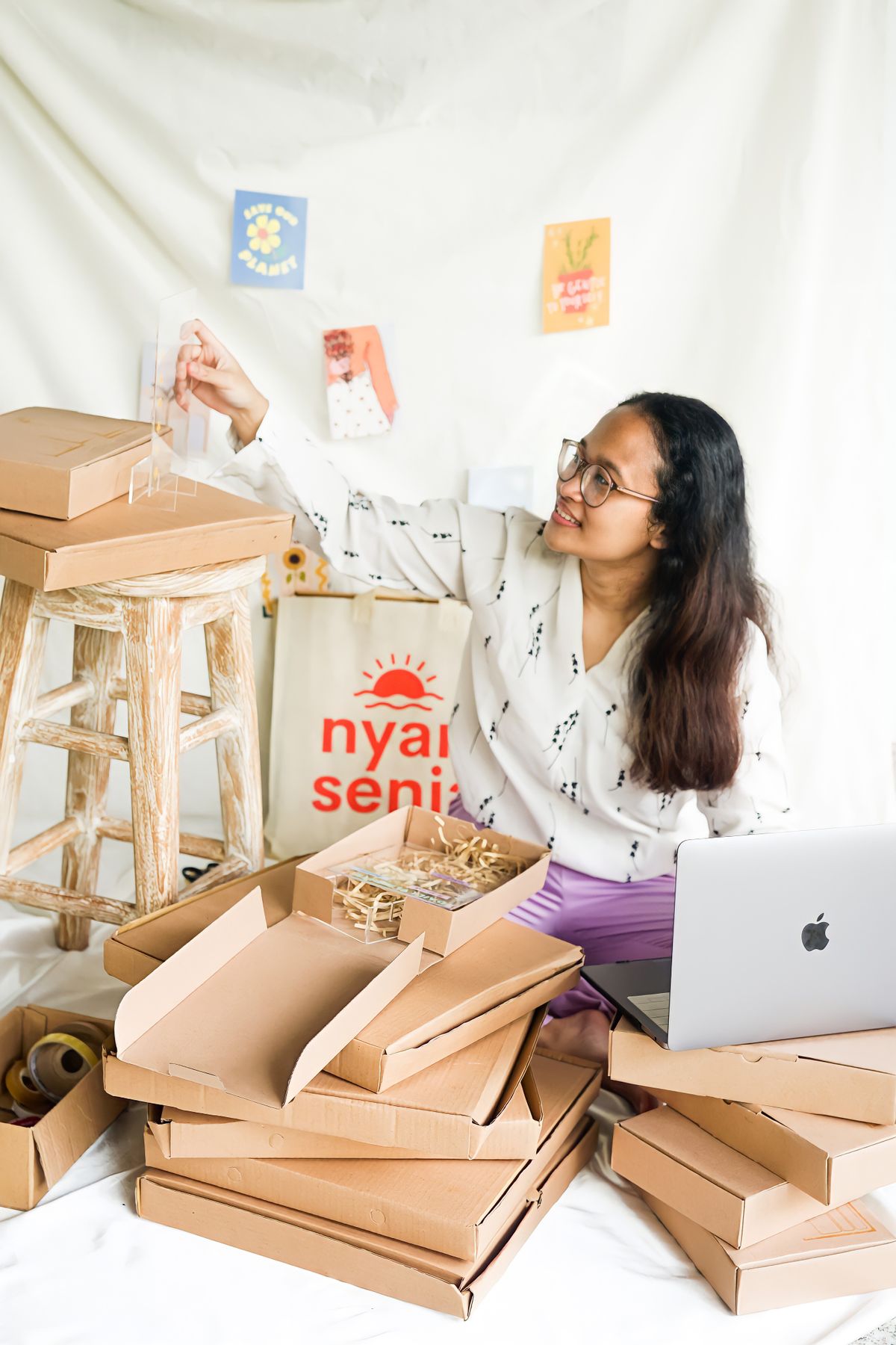 Entrepreneur preparing orders in her workspace